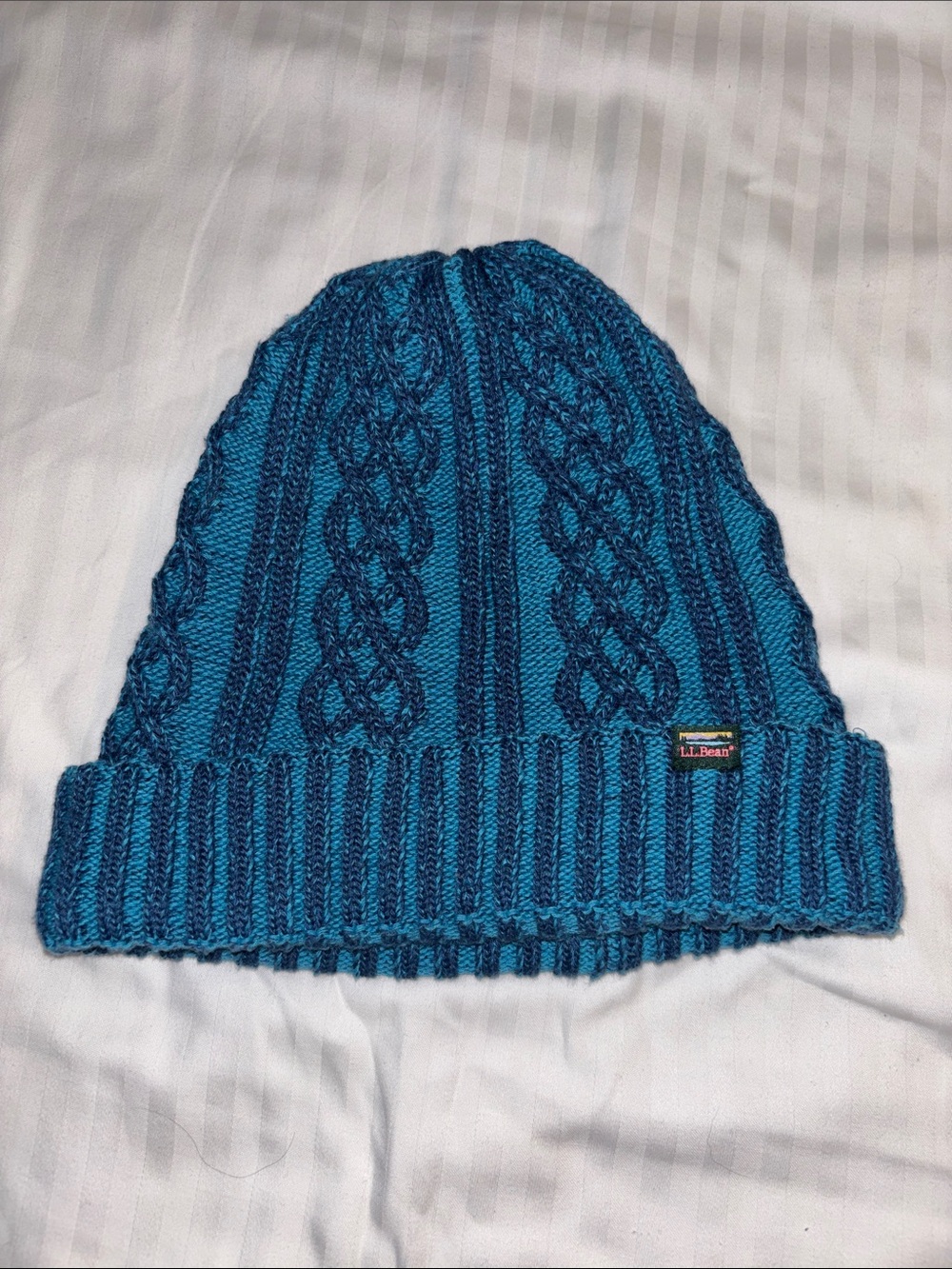 L.L. Bean Women’s Cable Knit Beanie in Teal and Navy
